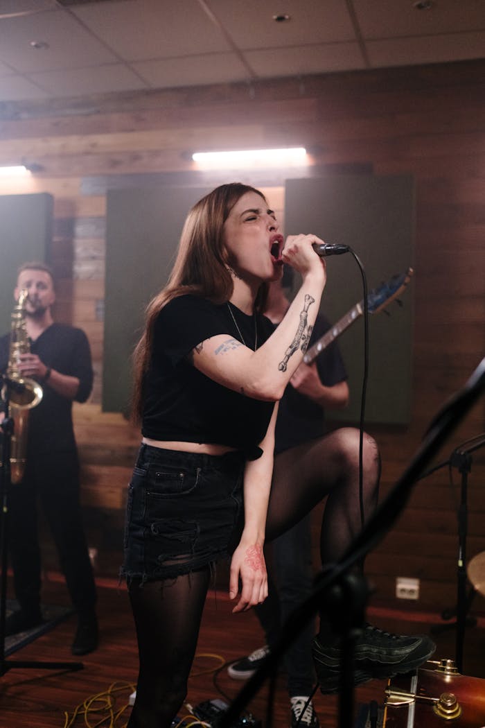 About Energetic female singer leads an indie band rehearsal with passion and intensity.